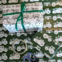 Gifts wrapped in tractor and farm animals themed gift wrap